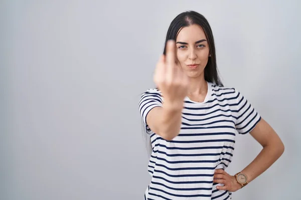 Young Brunette Woman Wearing Striped Shirt Showing Middle Finger Impolite — Foto de Stock