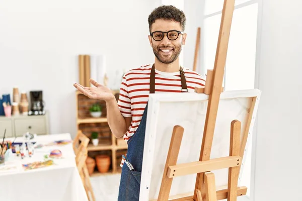 Arab Young Man Art Studio Pointing Aside Hands Open Palms — Stock Photo, Image