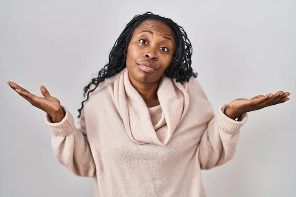 African Woman Standing White Background Clueless Confused Expression Arms Hands — стоковое фото