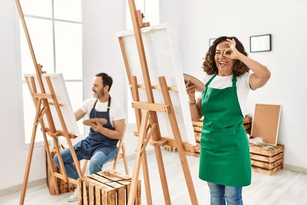 Hispanic Middle Age Woman Mature Man Art Studio Smiling Happy — Zdjęcie stockowe