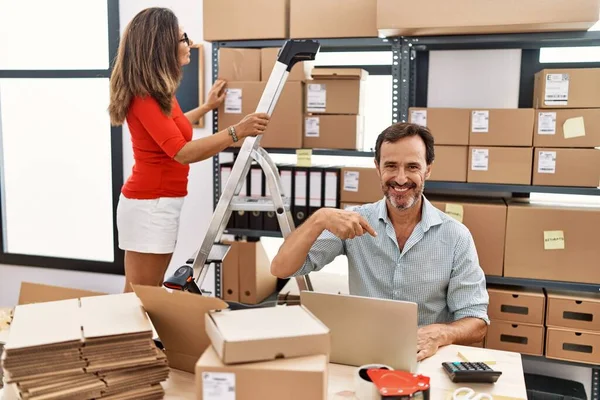 Two Middle Age Coworkers Working Small Business Ecommerce Pointing Finger — Photo