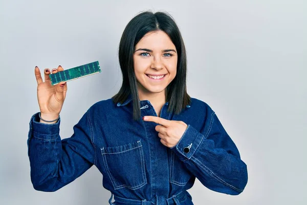 Young Brunette Woman Holding Computer Ram Smiling Happy Pointing Hand — Stok fotoğraf