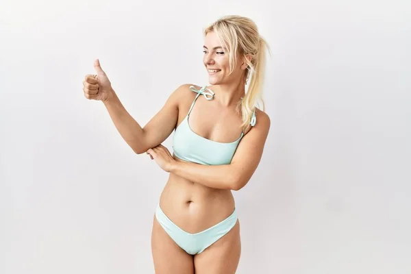 Young Caucasian Woman Wearing Bikini Isolated Background Looking Proud Smiling — Fotografia de Stock