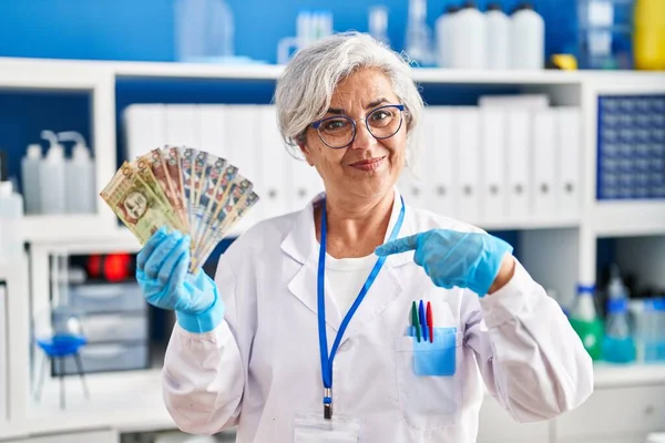 Middle Age Woman Grey Hair Working Scientist Laboratory Holding Polish — Zdjęcie stockowe