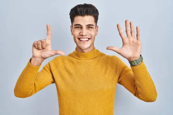 Young Hispanic Man Standing Blue Background Showing Pointing Fingers Number — Foto de Stock