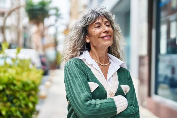 Middle Age Woman Smiling Confident Standing Arms Crossed Gesture Street — стоковое фото