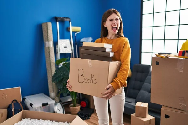 Young Brunette Woman Moving New Home Holding Box Angry Mad — 图库照片
