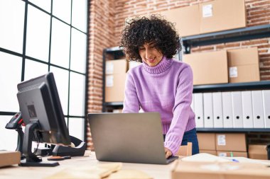 Young middle east woman ecommerce busines worker using laptop working at office