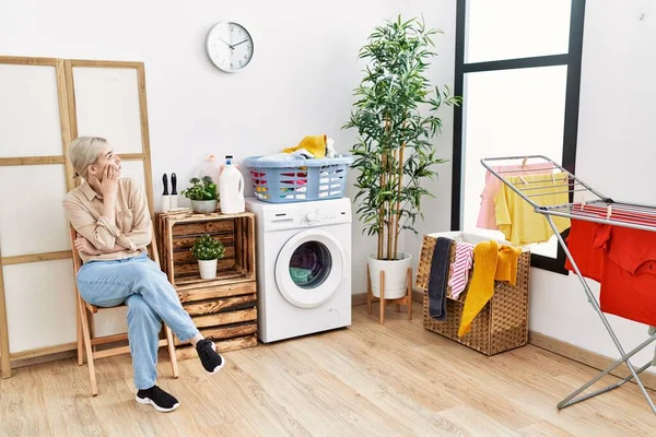 Young Caucasian Woman Boring Waiting Washing Machine Laundry Room — стоковое фото