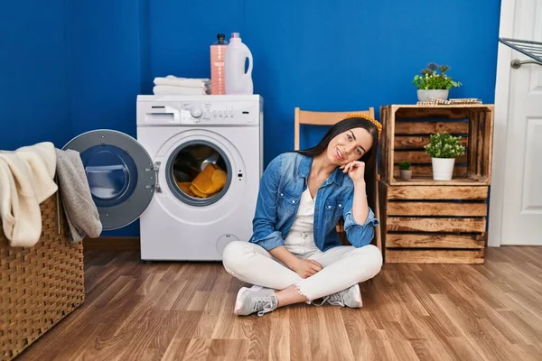 Hispanic Woman Doing Laundry Sitting Floor Serious Face Thinking Question — Fotografia de Stock