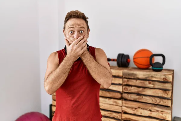 Middle Age Man Wearing Sportswear Headphones Gym Shocked Covering Mouth — Stok fotoğraf