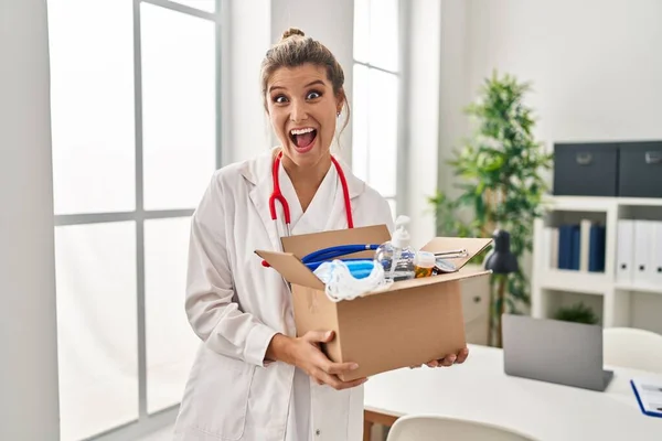 Young Doctor Woman Holding Box Medical Items Celebrating Crazy Amazed — Stock Photo, Image