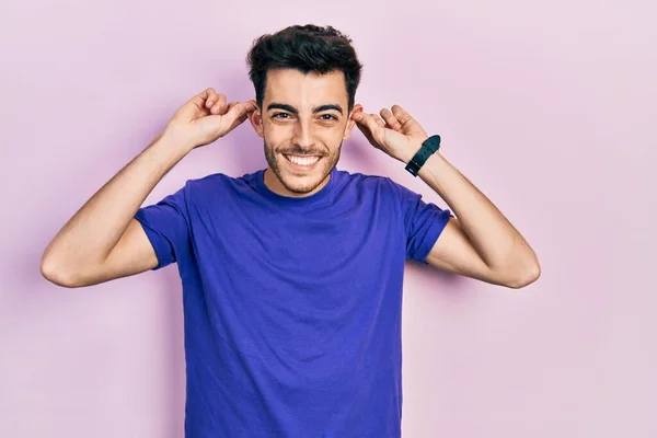 Young Hispanic Man Wearing Casual Shirt Smiling Pulling Ears Fingers — Stock Photo, Image