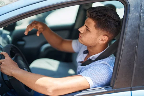 Young Hispanic Man Unhappy Driving Car Street — Foto Stock