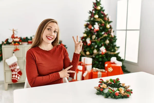 Caucasian Young Blonde Woman Sitting Table Christmas Tree Smiling Happy — Stock Photo, Image