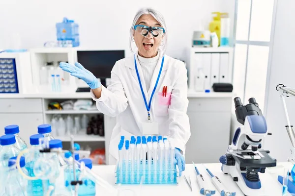 Middle Age Grey Haired Woman Wearing Scientist Uniform Celebrating Achievement — Fotografia de Stock