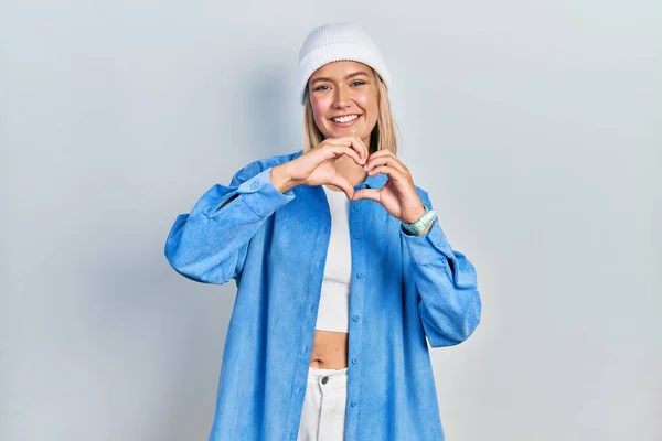 Beautiful Blonde Woman Wearing Wool Hat Smiling Love Doing Heart — Fotografia de Stock