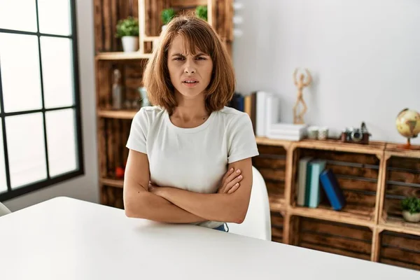 Young Caucasian Girl Wearing Casual Clothes Sitting Table Home Skeptic —  Fotos de Stock