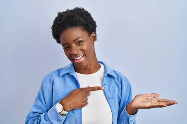 African American Woman Standing Blue Background Amazed Smiling Camera While — стоковое фото