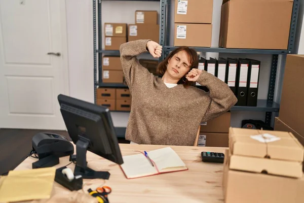 Young Caucasian Woman Ecommerce Business Worker Tired Stretching Arms Office — стоковое фото