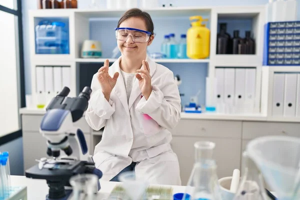 Hispanic Girl Syndrome Working Scientist Laboratory Gesturing Finger Crossed Smiling — Stock fotografie