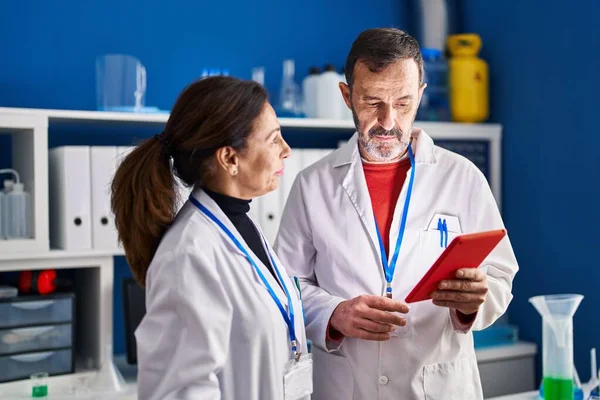 Middle Age Man Woman Scientists Using Touchpad Working Laboratory —  Fotos de Stock