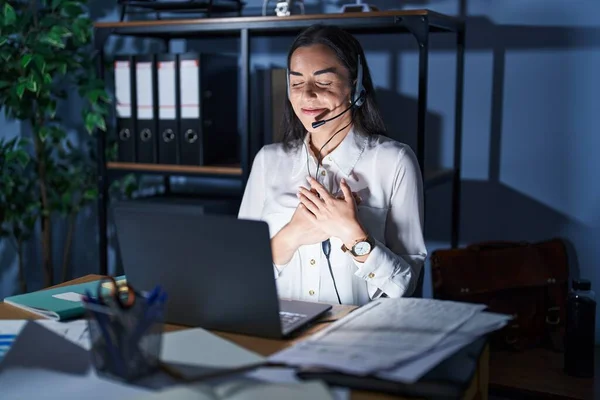 Young Brunette Woman Wearing Call Center Agent Headset Working Late — Stockfoto