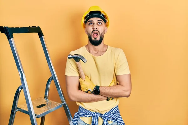 Handsome Man Beard Wearing Hardhat Holding Hammer Stairs Angry Mad — 스톡 사진