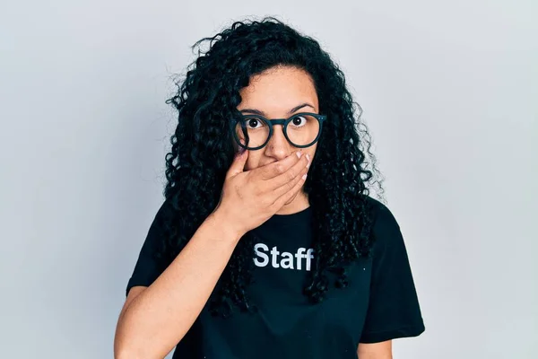 Young Hispanic Woman Curly Hair Wearing Staff Shirt Shocked Covering — Stockfoto