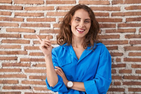 Beautiful Brunette Woman Standing Bricks Wall Big Smile Face Pointing — Stock fotografie