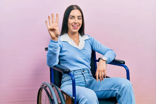 Beautiful Woman Blue Eyes Sitting Wheelchair Showing Pointing Fingers Number — Stock fotografie