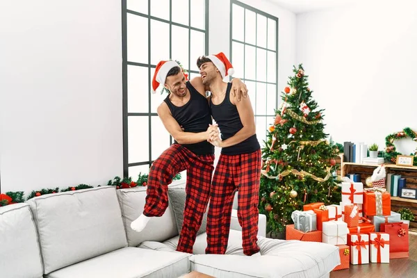 Two Hispanic Men Couple Dancing Standing Sofa Christmas Tree Home — Stock Photo, Image