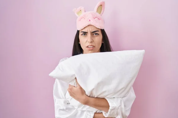 Young Brunette Woman Wearing Sleep Mask Pajama Hugging Pillow Clueless — Foto Stock