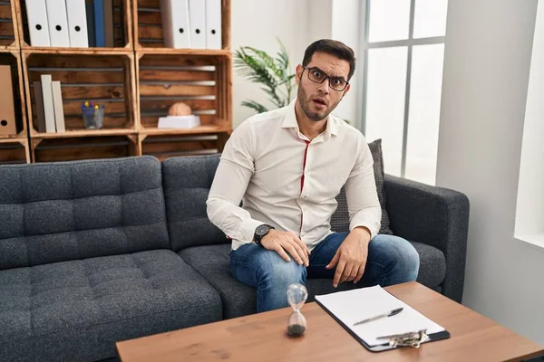 Young Hispanic Man Beard Working Consultation Office Shock Face Looking — Stock Fotó