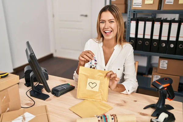 Young Blonde Woman Working Small Business Ecommerce Smiling Laughing Hard — Stock fotografie