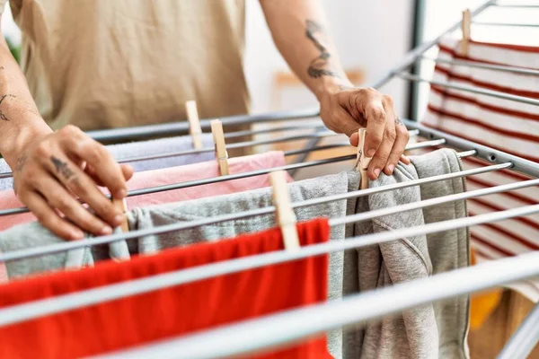 Young Hispanic Man Hanging Clothes Laundry Room — Foto de Stock