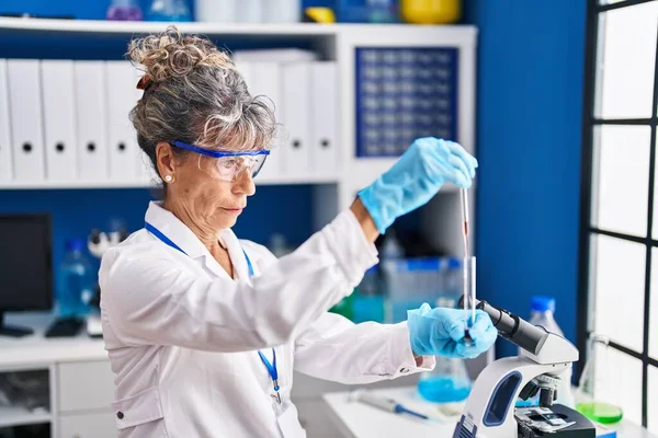 Middle Age Woman Scientist Measuring Liquid Laboratory — Stock Photo, Image