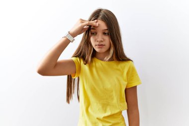 Young brunette teenager standing together over isolated background worried and stressed about a problem with hand on forehead, nervous and anxious for crisis 