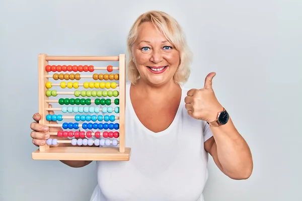 Middle Age Blonde Woman Holding Traditional Abacus Smiling Happy Positive — Foto Stock