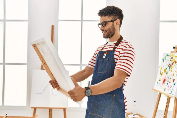 Young Arab Artist Man Smiling Happy Holding Canvas Art Studio — Stok fotoğraf