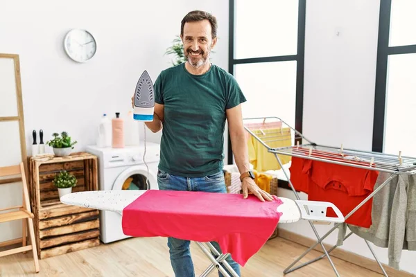 Middle Age Man Beard Ironing Clothes Home Looking Positive Happy — Foto de Stock