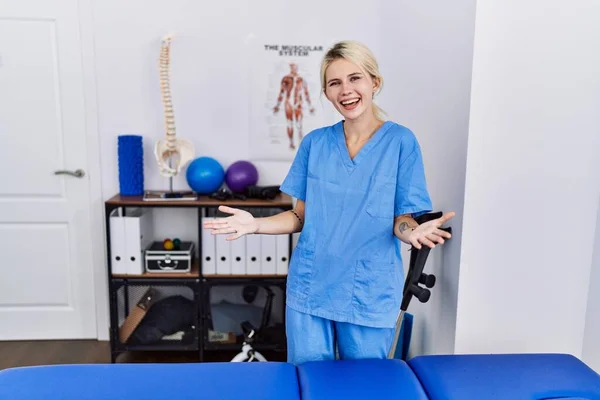 Young Physiotherapist Woman Working Pain Recovery Clinic Smiling Cheerful Open —  Fotos de Stock