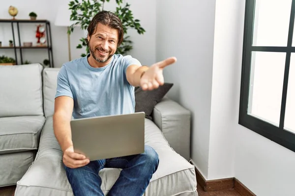 Handsome Middle Age Man Using Computer Laptop Sofa Smiling Friendly — Stok fotoğraf