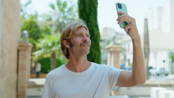 Young Blond Man Smiling Confident Making Selfie Smartphone Street — ストック写真