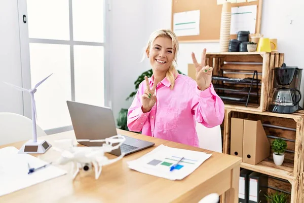 Young Caucasian Woman Working Office Smiling Looking Camera Showing Fingers — Stock fotografie