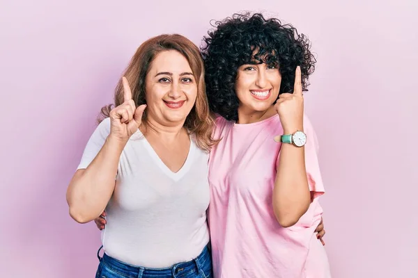 Middle East Mother Daughter Wearing Casual Clothes Pointing Finger Successful — Stock Photo, Image