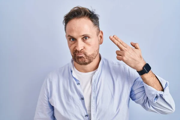 Middle Age Caucasian Man Standing Blue Background Shooting Killing Oneself — Fotografia de Stock