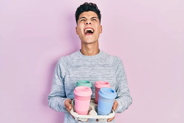 Young Hispanic Man Holding Tray Take Away Coffee Angry Mad — Stock Fotó