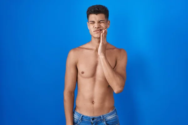 Young Hispanic Man Standing Shirtless Blue Background Touching Mouth Hand — Stockfoto