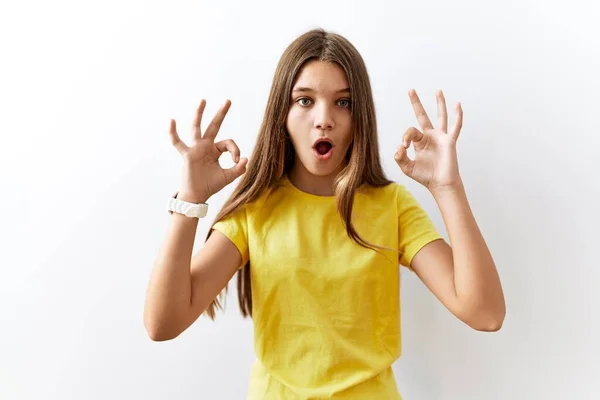 Young Brunette Teenager Standing Together Isolated Background Looking Surprised Shocked — Stockfoto